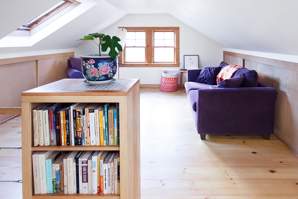Inspiration for a small contemporary loft-style light wood floor and beige floor family room library remodel in Portland Maine with white walls, no tv and no fireplace