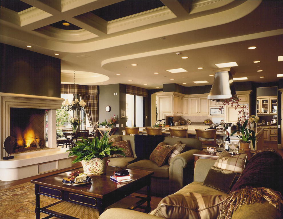 Example of a mid-sized tuscan open concept medium tone wood floor family room design in Orange County with brown walls, a standard fireplace and no tv