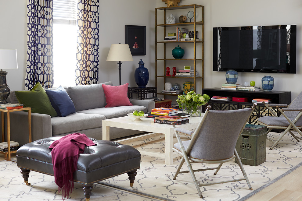 This is an example of a classic games room in New York with white walls, light hardwood flooring and a wall mounted tv.