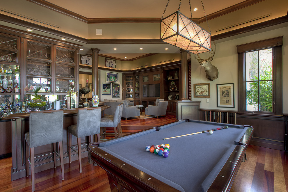 Elegant open concept dark wood floor family room photo in Miami with beige walls