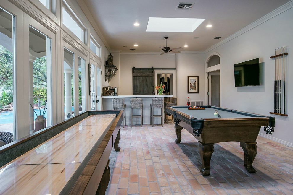 Example of a huge transitional brick floor and beige floor family room design in Austin