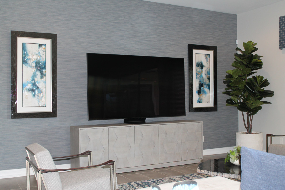 Inspiration for a huge transitional open concept porcelain tile and wallpaper family room remodel in Phoenix with gray walls and a tv stand