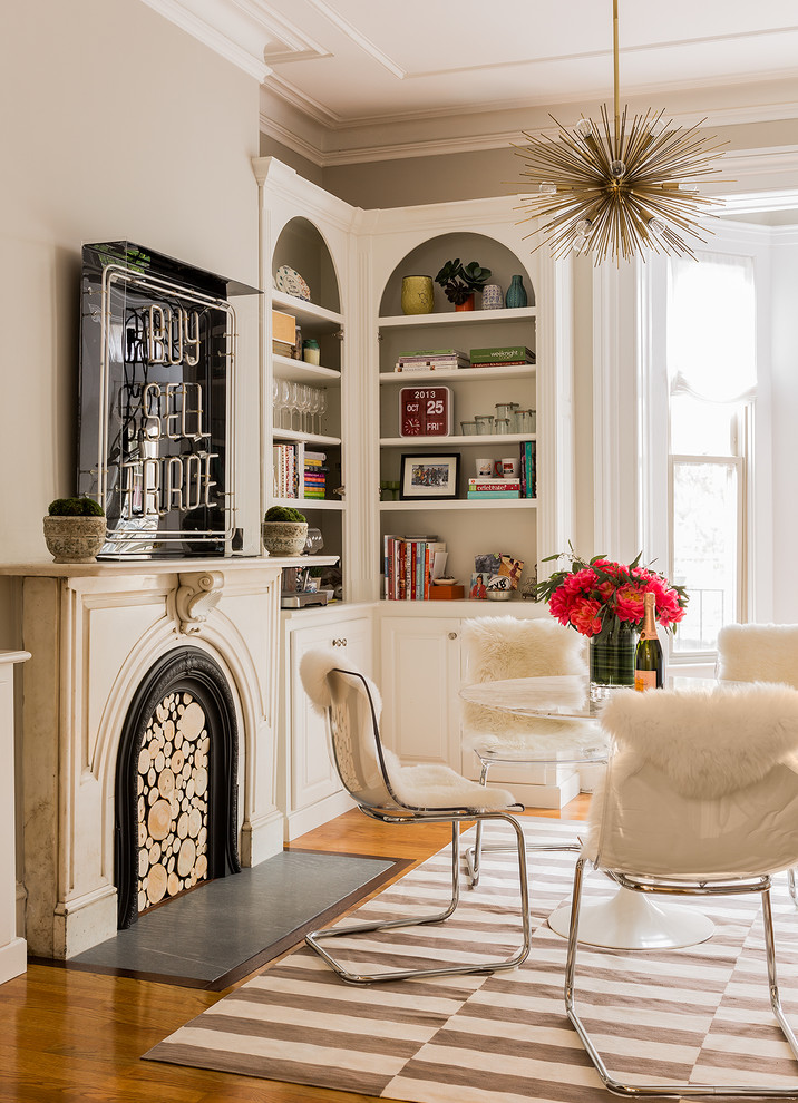 Classic games room in Boston with beige walls, medium hardwood flooring and brown floors.