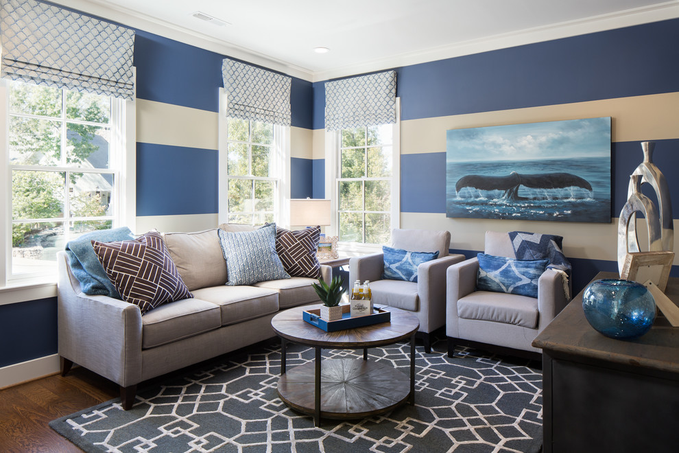 Inspiration for a coastal dark wood floor and brown floor family room remodel in Birmingham with multicolored walls