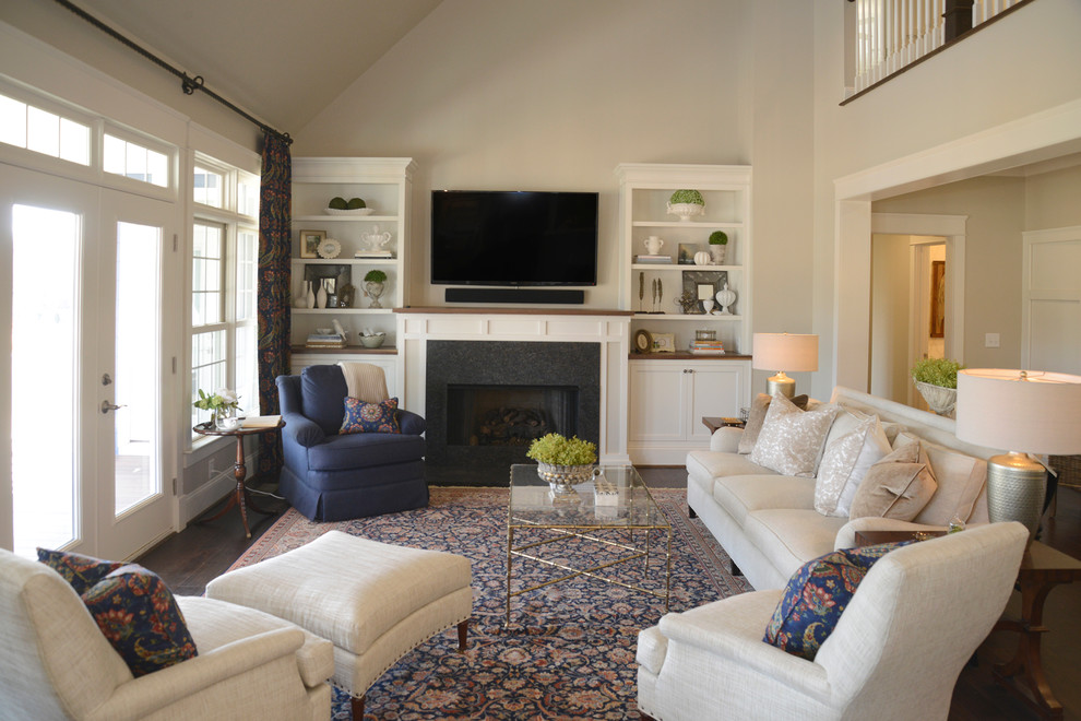 Transitional open concept dark wood floor family room photo in Other with beige walls, a standard fireplace, a wood fireplace surround and a wall-mounted tv