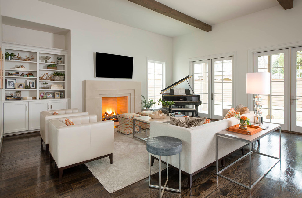 Example of a transitional open concept dark wood floor family room design in Dallas with gray walls, a standard fireplace, a stone fireplace and a wall-mounted tv