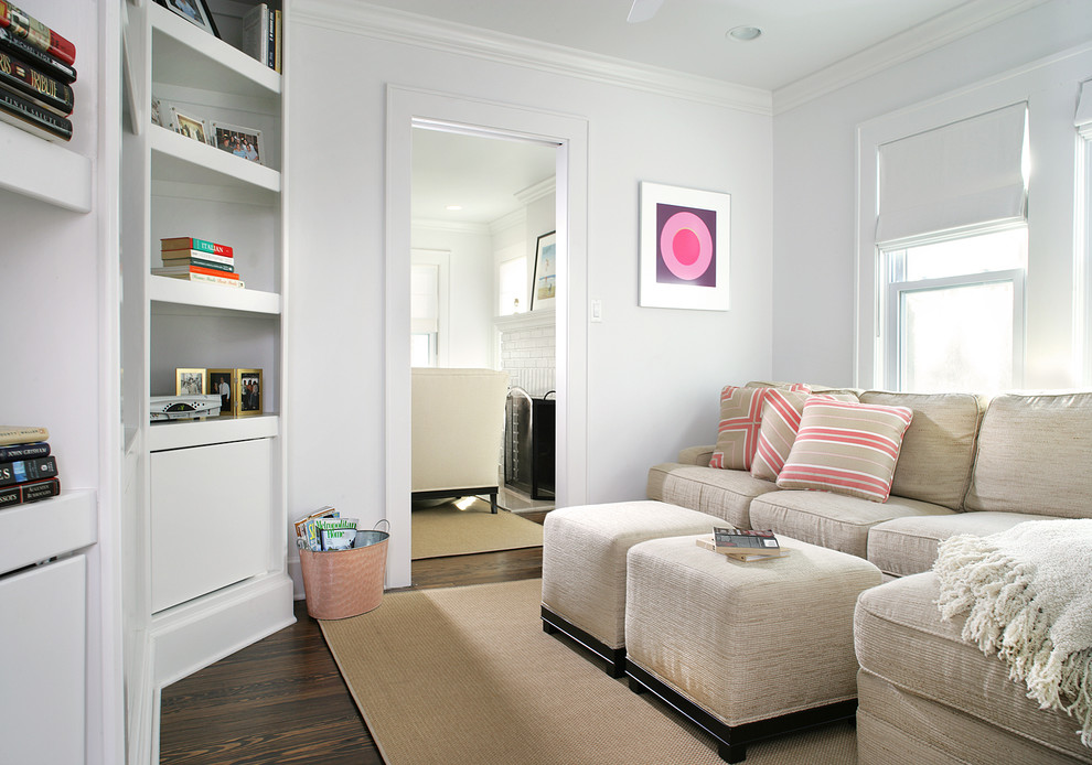 Example of a small transitional enclosed dark wood floor family room design in New York with white walls