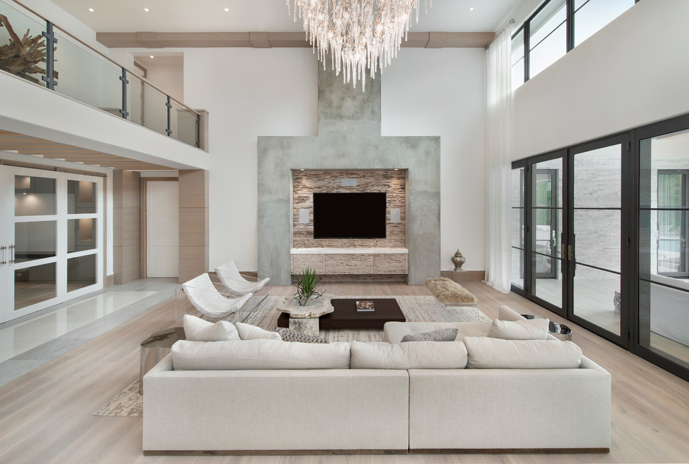 Trendy light wood floor family room photo in Miami with white walls, no fireplace and a wall-mounted tv