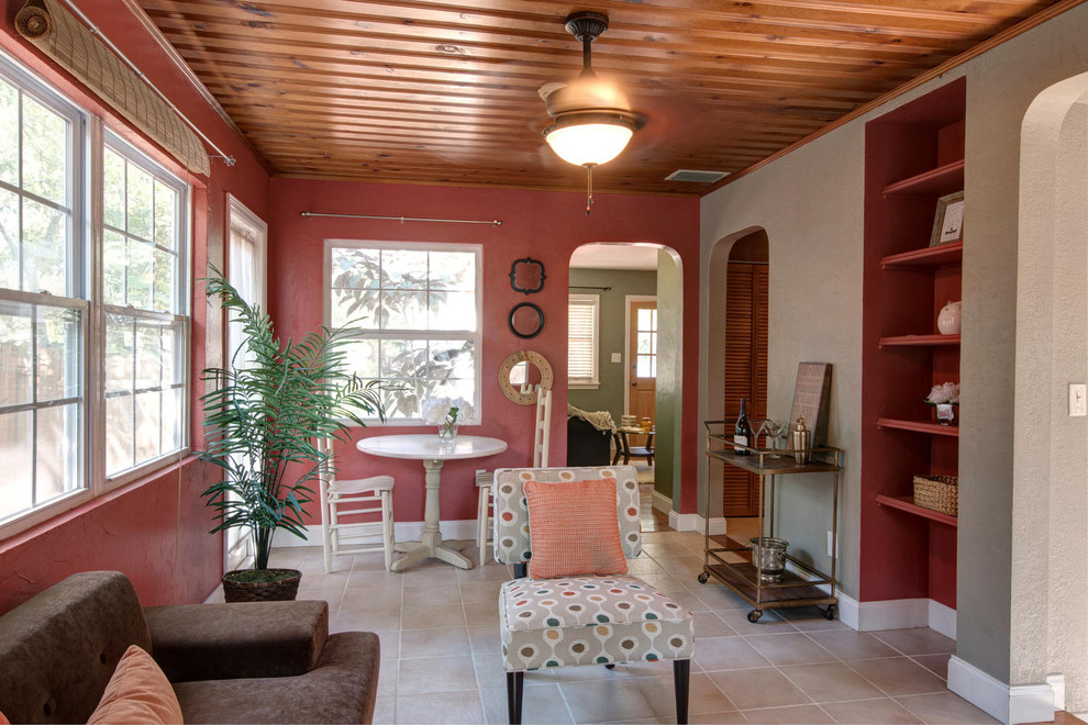 This is an example of a large classic enclosed games room in Tampa with red walls and porcelain flooring.