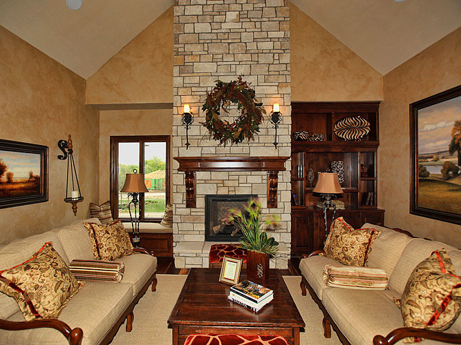 Example of a mid-sized classic open concept dark wood floor family room design in Wichita with beige walls, a standard fireplace and a stone fireplace