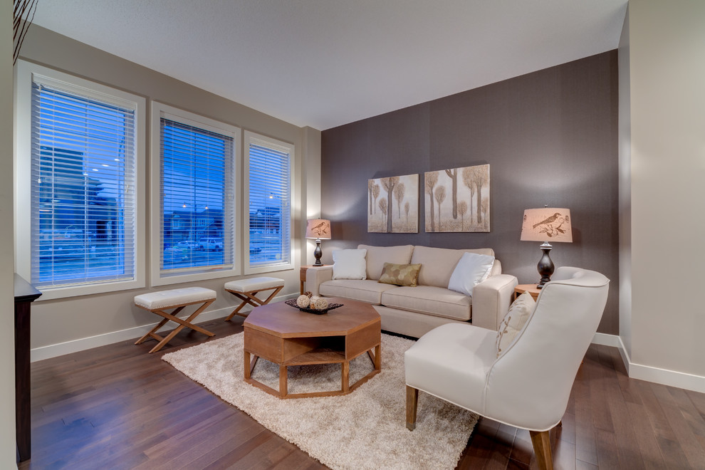 Family room - contemporary medium tone wood floor family room idea in Calgary with multicolored walls