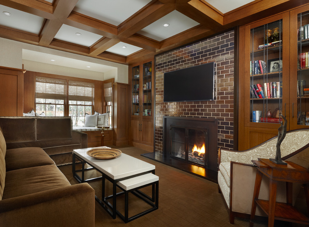 Example of a mid-sized trendy enclosed medium tone wood floor living room library design in Detroit with beige walls, a standard fireplace, a metal fireplace and a wall-mounted tv