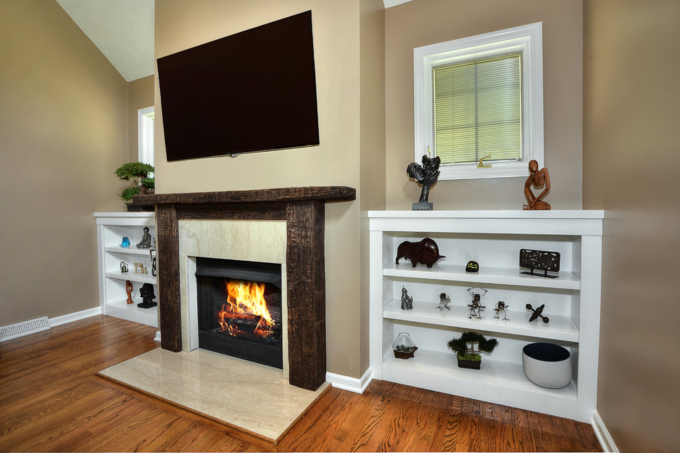 Large contemporary games room in Other with beige walls, medium hardwood flooring, a standard fireplace, a stone fireplace surround and a built-in media unit.
