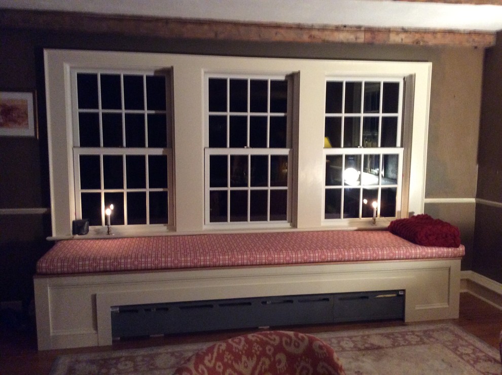 Example of a country family room design in Boston