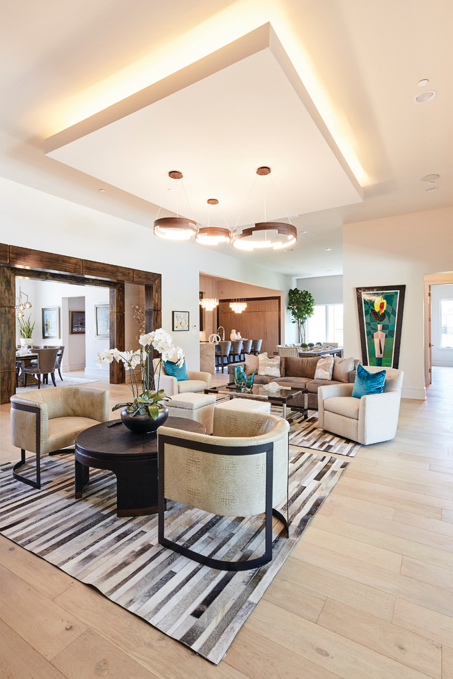 Inspiration for a medium sized contemporary open plan games room in Dallas with white walls, light hardwood flooring, a ribbon fireplace, a stone fireplace surround, a wall mounted tv and brown floors.