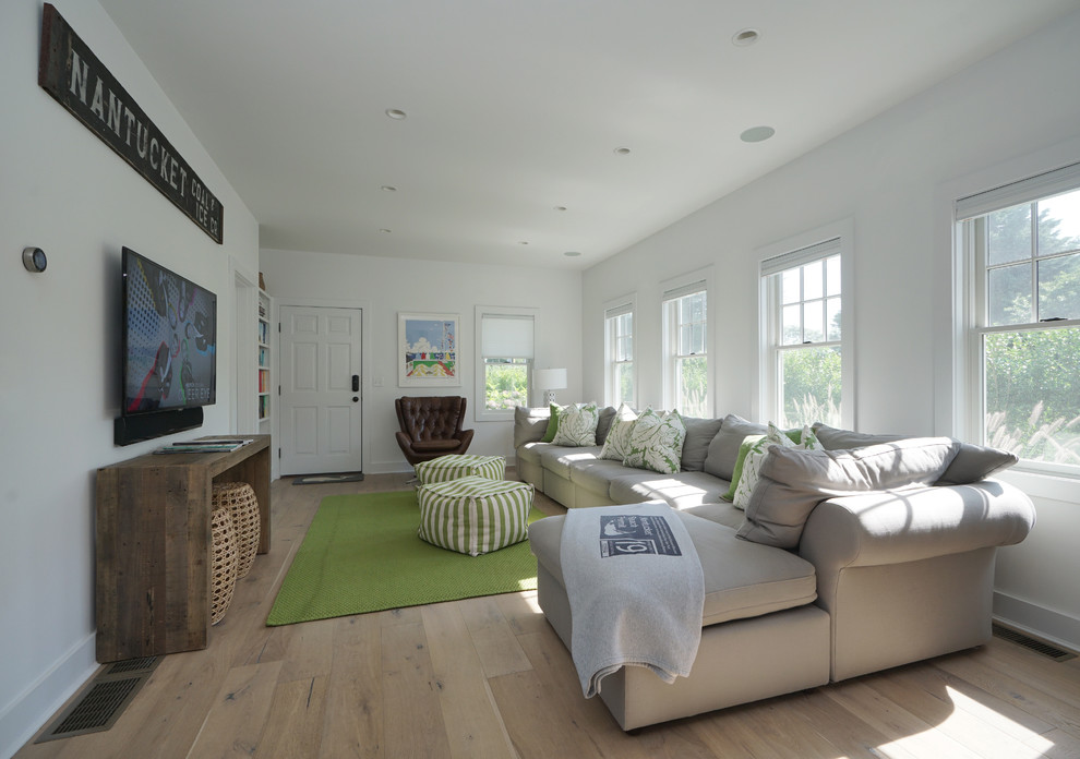 Example of a beach style family room design in Boston