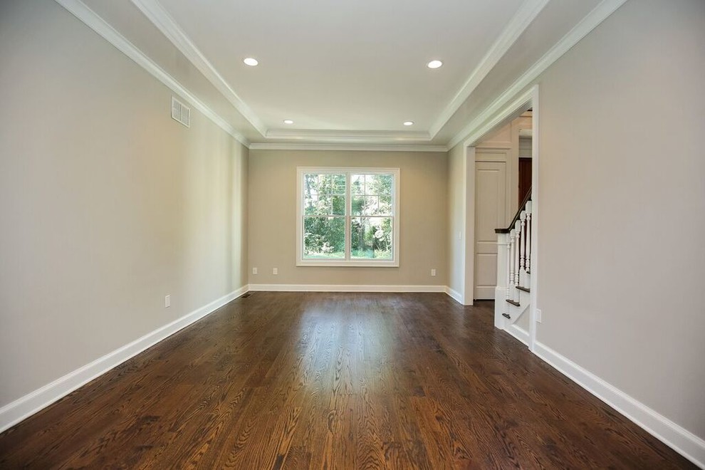 Design ideas for a medium sized traditional enclosed games room in New York with grey walls, dark hardwood flooring, no fireplace and no tv.