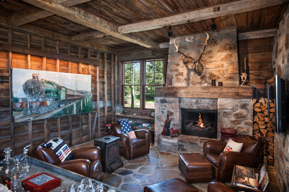 Rustic enclosed games room in Salt Lake City with a stone fireplace surround and a wall mounted tv.