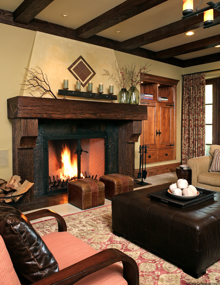 Inspiration for a rustic family room remodel in San Francisco with beige walls, a standard fireplace and a wood fireplace surround