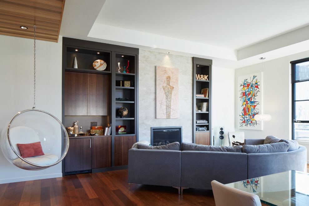 Trendy open concept dark wood floor family room photo in Portland with white walls and a standard fireplace