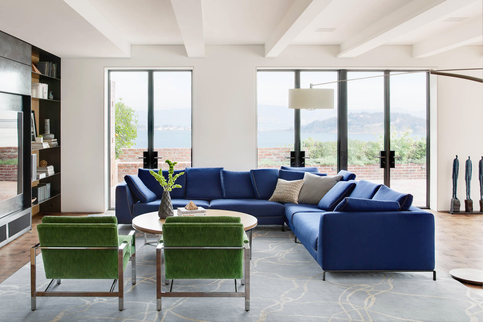 Photo of a large contemporary open plan games room in San Francisco with white walls and a built-in media unit.