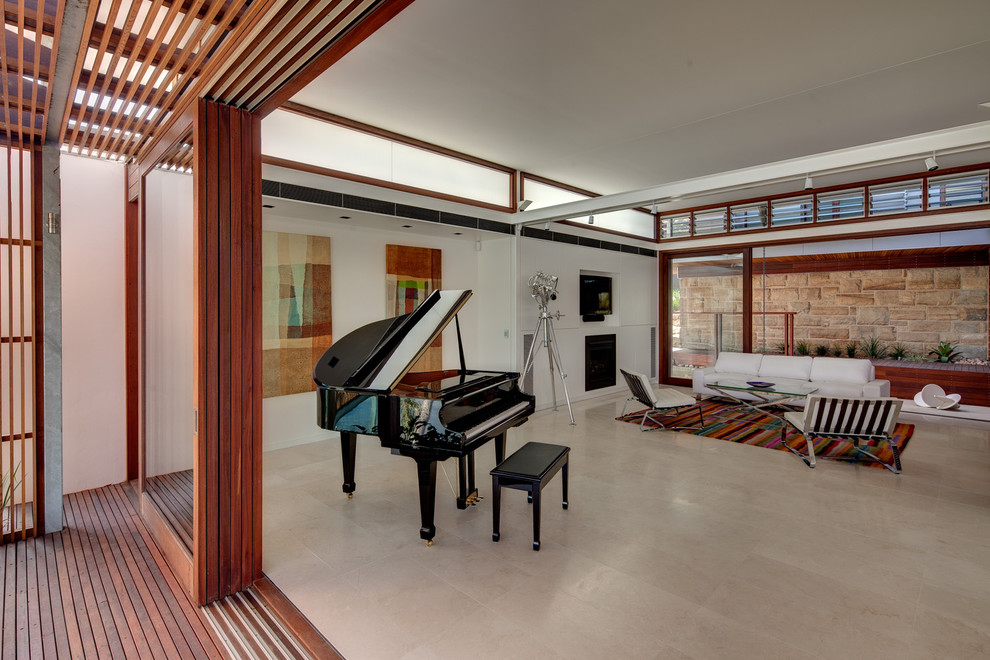 Inspiration for a contemporary open plan games room in Sydney with a music area and a wall mounted tv.