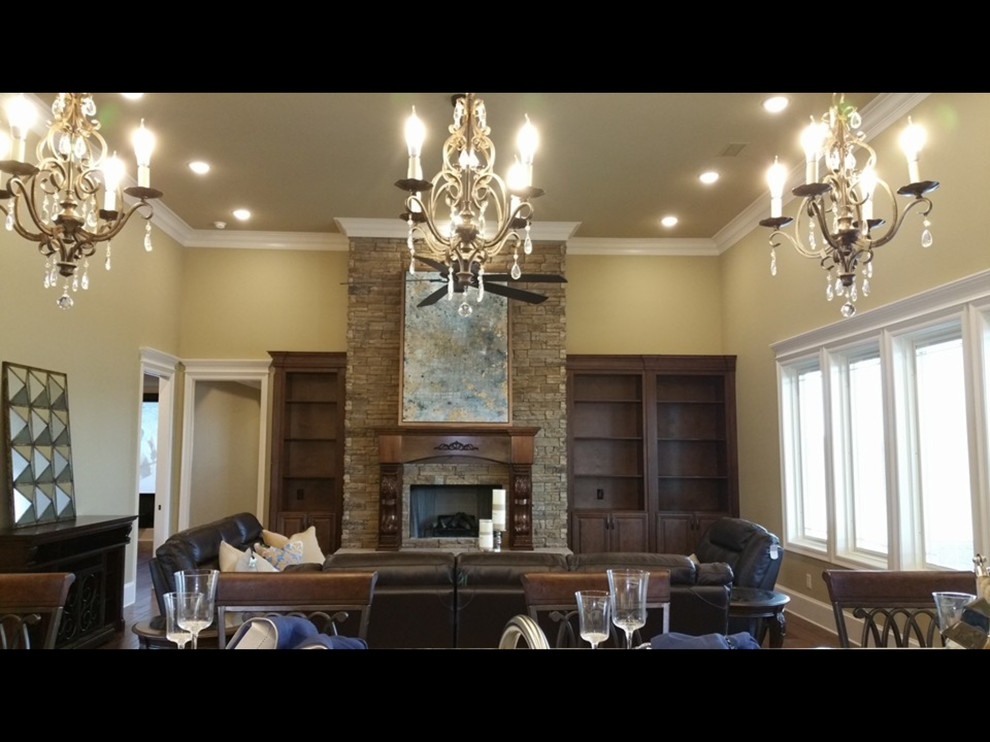 This is an example of a medium sized contemporary open plan games room in Other with beige walls, medium hardwood flooring, a standard fireplace, a stone fireplace surround and no tv.
