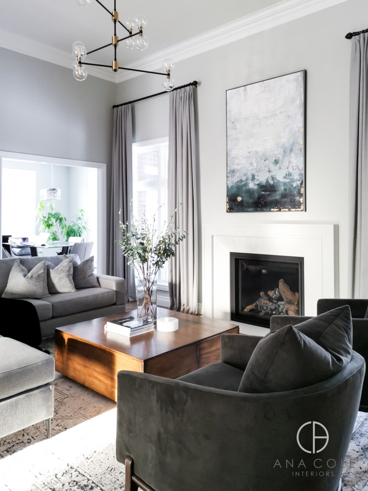 Large scandi enclosed living room in Toronto with grey walls, light hardwood flooring, a ribbon fireplace, a plastered fireplace surround, a wall mounted tv and brown floors.