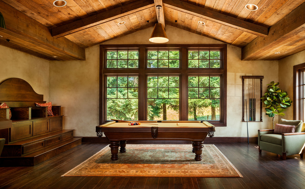 Design ideas for an expansive rustic enclosed games room in Portland with beige walls and dark hardwood flooring.