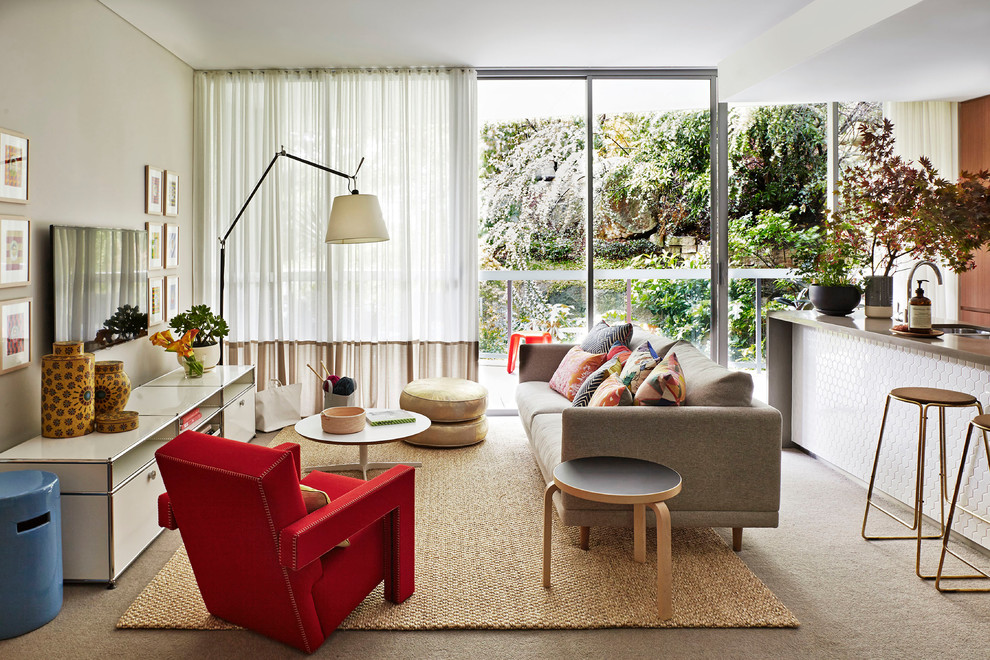 Family room - mid-sized contemporary open concept carpeted family room idea in Sydney with no fireplace, a wall-mounted tv and beige walls