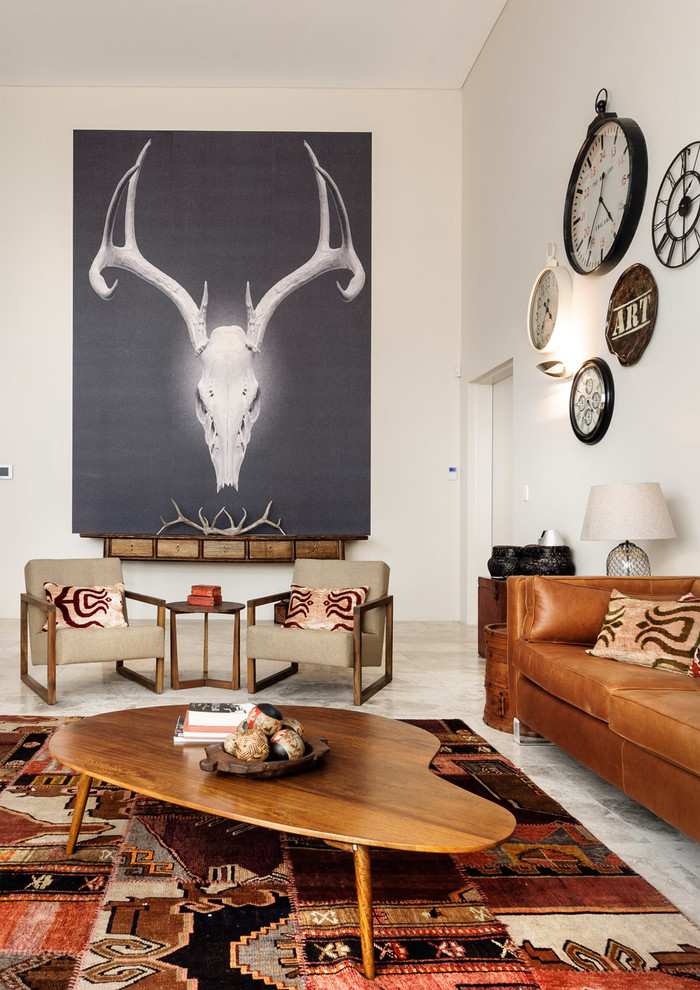 This is an example of an expansive eclectic mezzanine games room in Perth with white walls and travertine flooring.