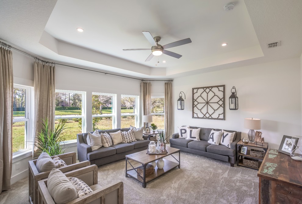 This is an example of a traditional games room in Jacksonville with white walls, carpet and grey floors.