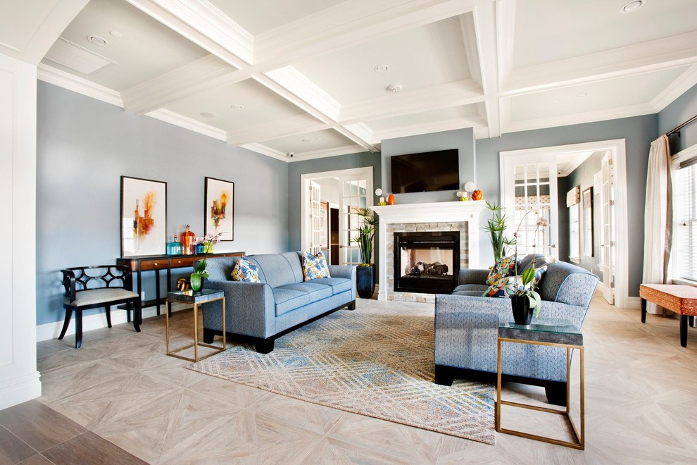 This is an example of a large contemporary open plan games room in New York with blue walls, ceramic flooring, a two-sided fireplace, a wooden fireplace surround and a wall mounted tv.