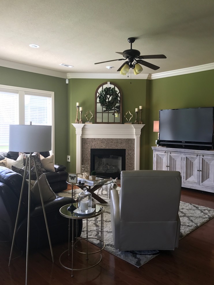 Example of a mid-sized transitional open concept medium tone wood floor and brown floor family room design in Other with green walls, a standard fireplace, a tile fireplace and a tv stand