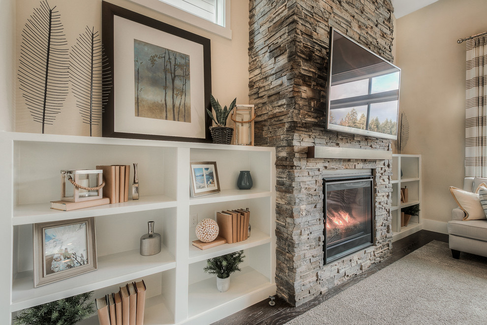 Open concept dark wood floor family room photo in Seattle with gray walls, a standard fireplace, a stone fireplace and a wall-mounted tv