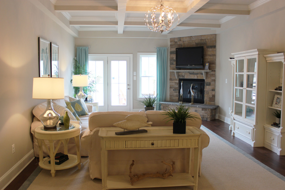 Example of a beach style open concept medium tone wood floor family room design in Other with white walls, a standard fireplace and a wall-mounted tv