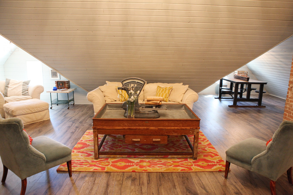 Example of a mid-sized cottage medium tone wood floor family room design in Austin with white walls
