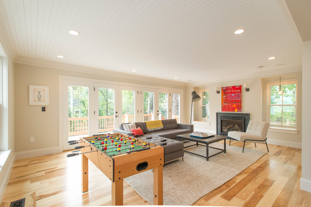 Photo of a traditional open plan games room in Boston with a game room, no tv and a standard fireplace.