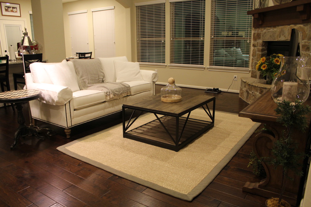 Rural games room in Houston with beige walls, dark hardwood flooring, a corner fireplace and a freestanding tv.