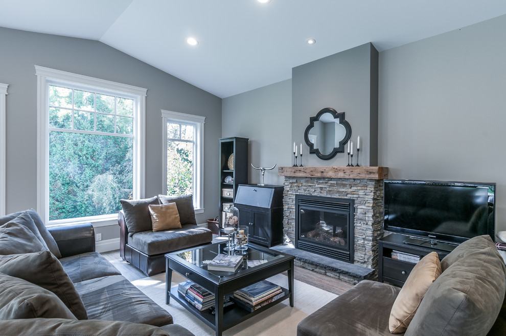 Design ideas for a large classic open plan games room in Toronto with grey walls, dark hardwood flooring, a standard fireplace, a stone fireplace surround and a freestanding tv.