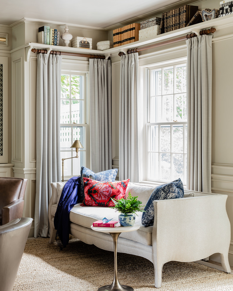 This is an example of a traditional games room in Boston with a reading nook and beige walls.