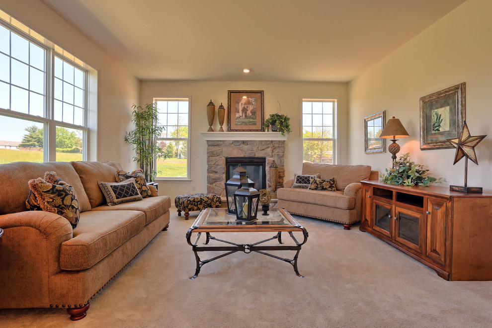 Photo of a large traditional open plan games room in Other with carpet, a standard fireplace, a stone fireplace surround and beige floors.