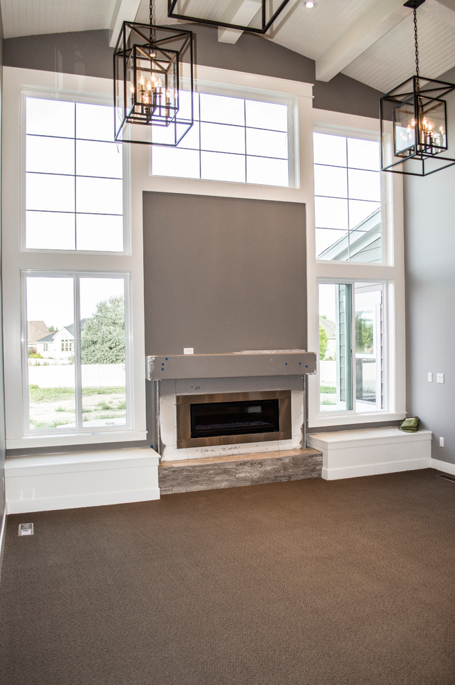 Inspiration for a large transitional open concept carpeted family room remodel in Salt Lake City with gray walls, a standard fireplace and a tile fireplace