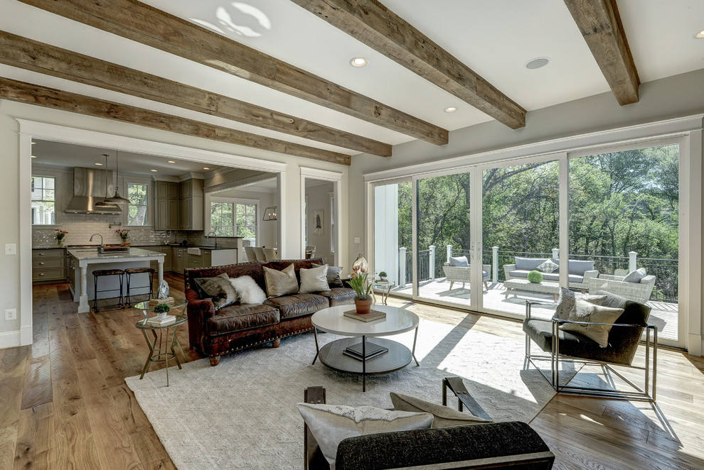 Inspiration for a large modern open concept light wood floor family room remodel in DC Metro with gray walls and no tv