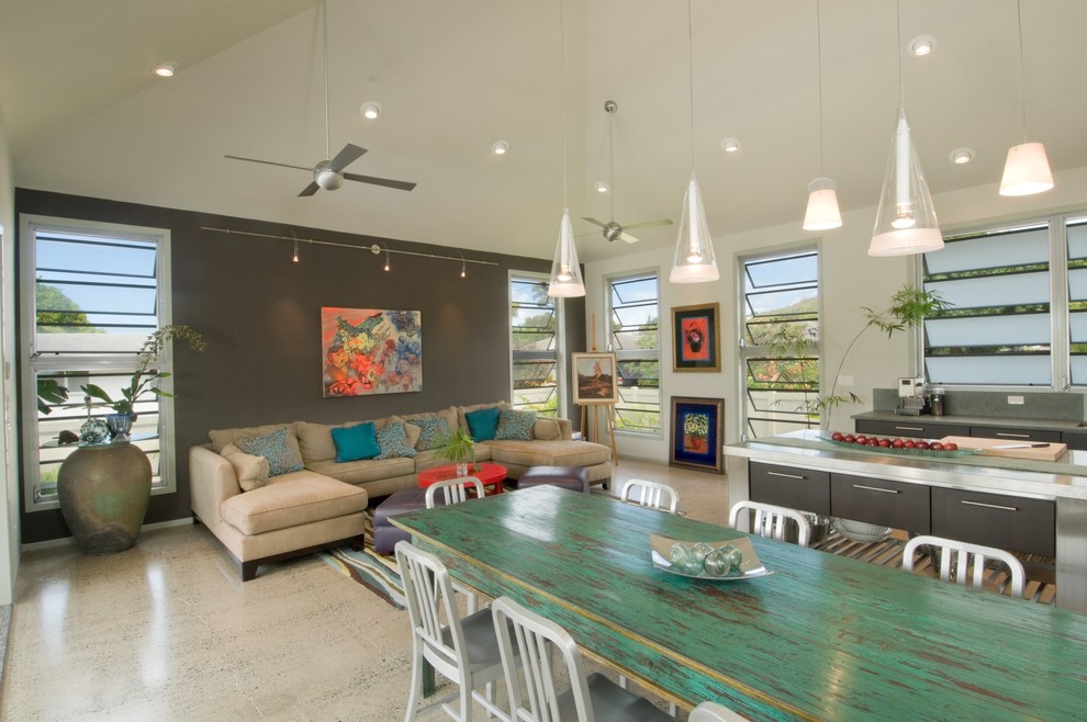 This is an example of a world-inspired open plan games room in Hawaii with multi-coloured walls and a feature wall.