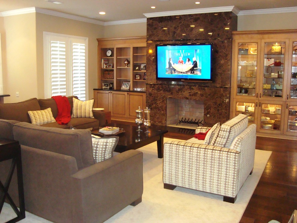 Medium sized classic open plan games room in Los Angeles with beige walls, dark hardwood flooring, a standard fireplace and a wall mounted tv.