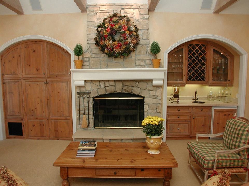 Inspiration for a large enclosed games room in Sacramento with beige walls, carpet, a standard fireplace, a stone fireplace surround, a concealed tv and beige floors.