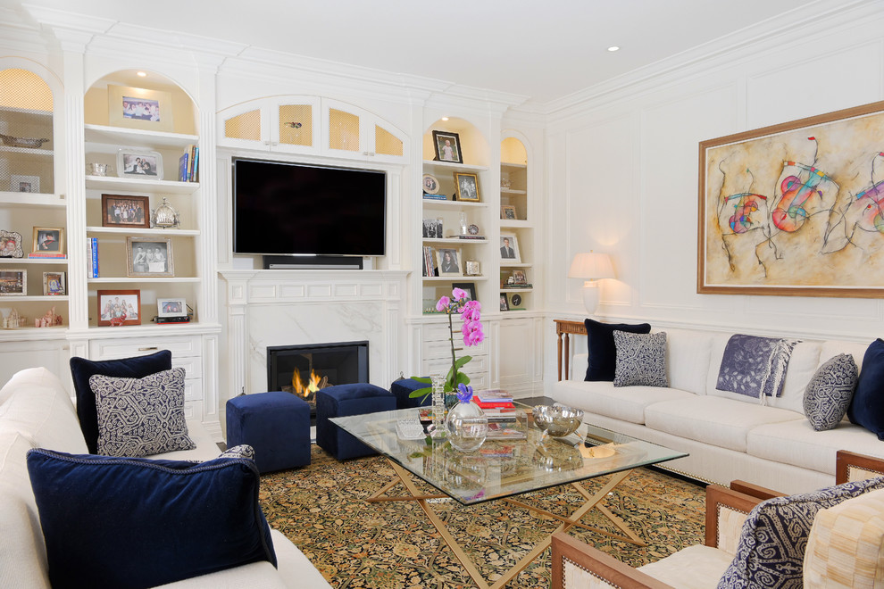 Design ideas for a traditional games room in Toronto with white walls, a standard fireplace and a wall mounted tv.