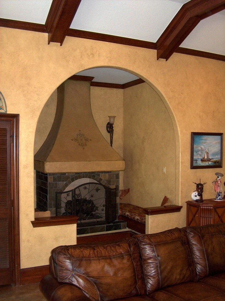 Example of an island style family room design in Houston