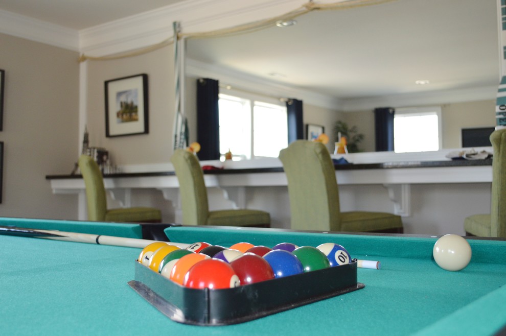 Nautical enclosed games room in DC Metro with a game room, beige walls, carpet and a standard fireplace.